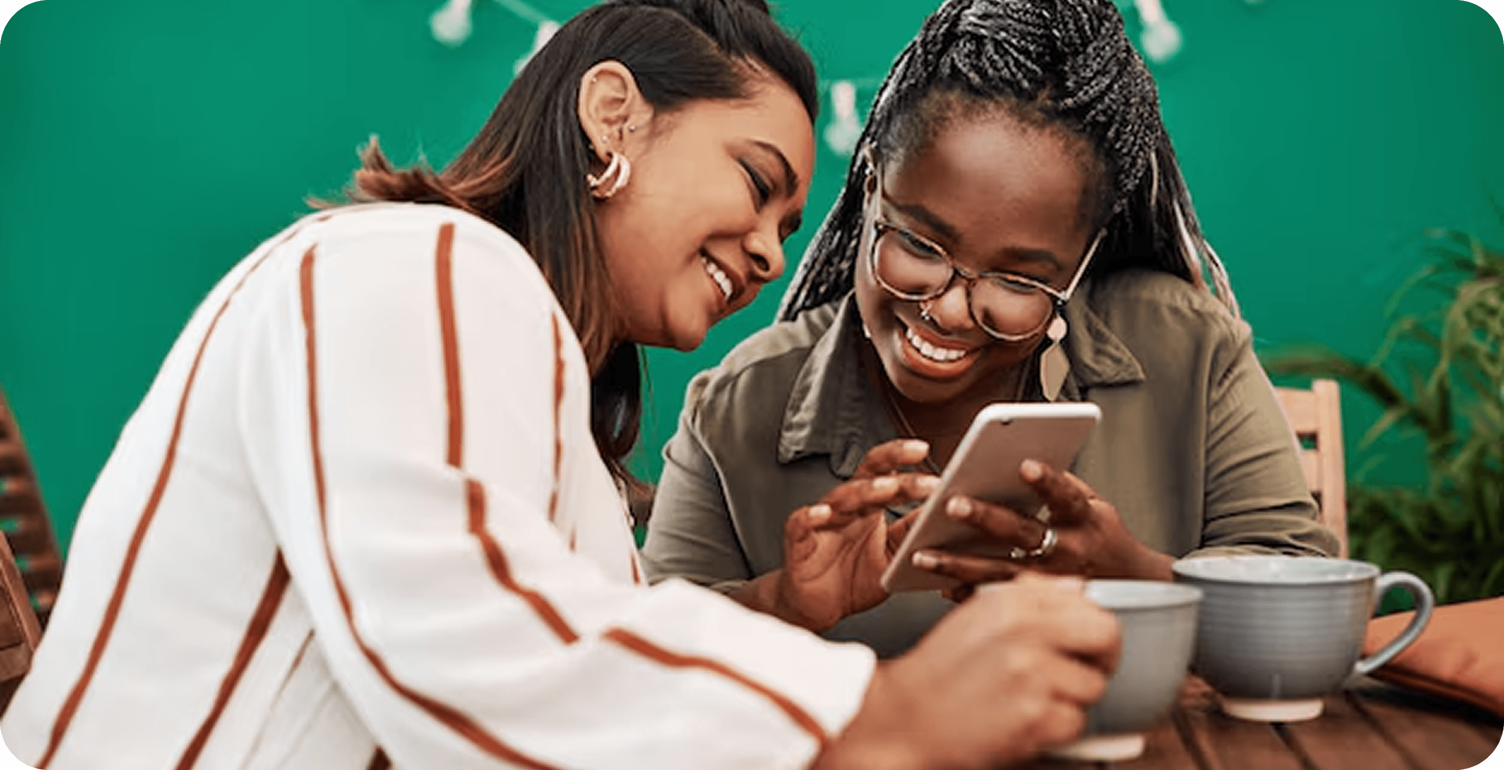 Women looking at phone together